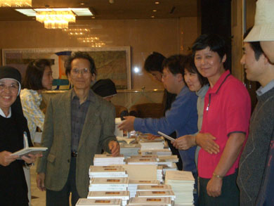 Mr. Hayashi, the publisher of TLIG books in Japan, among TLIG helpers and readers