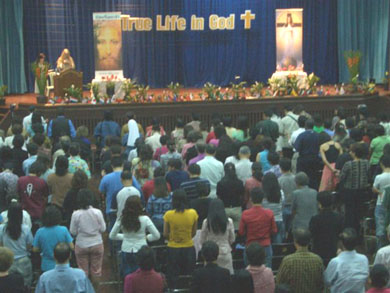 People standing, invoking the Holy Spirit for healing and deliverance
